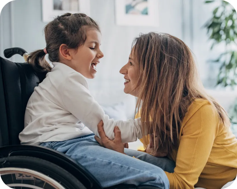 Pediatric Crohn's patient in a wheelchair with a parent