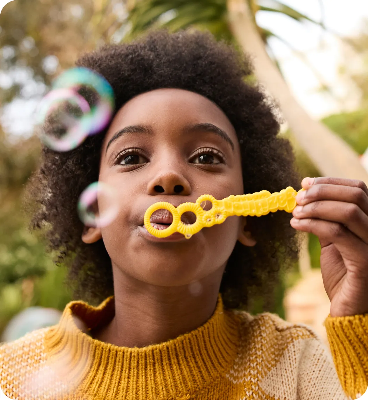 Pediatric Crohn's patient blowing bubbles
