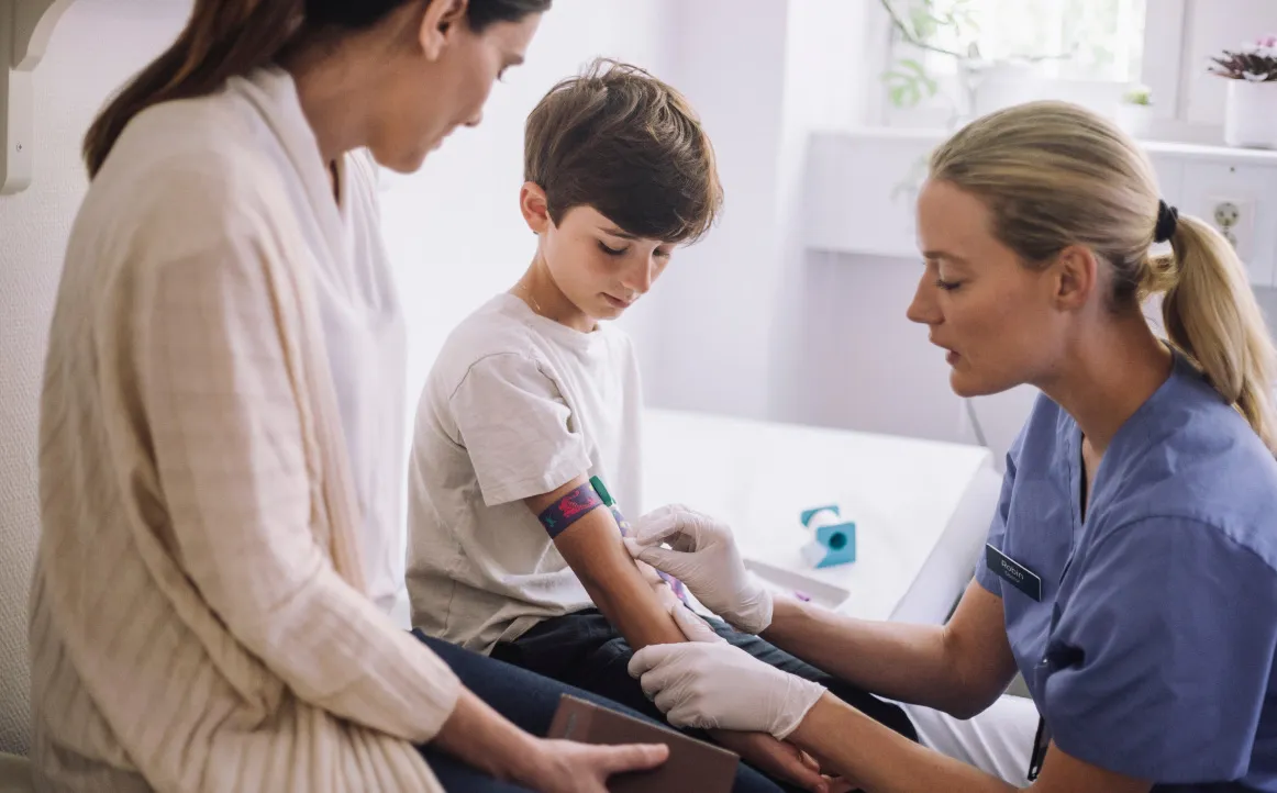 Pediatric IBD patient being examined by a provider