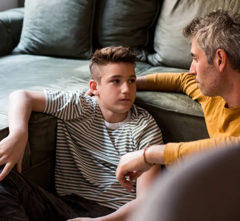 Pediatric IBD patient comforted by a parent