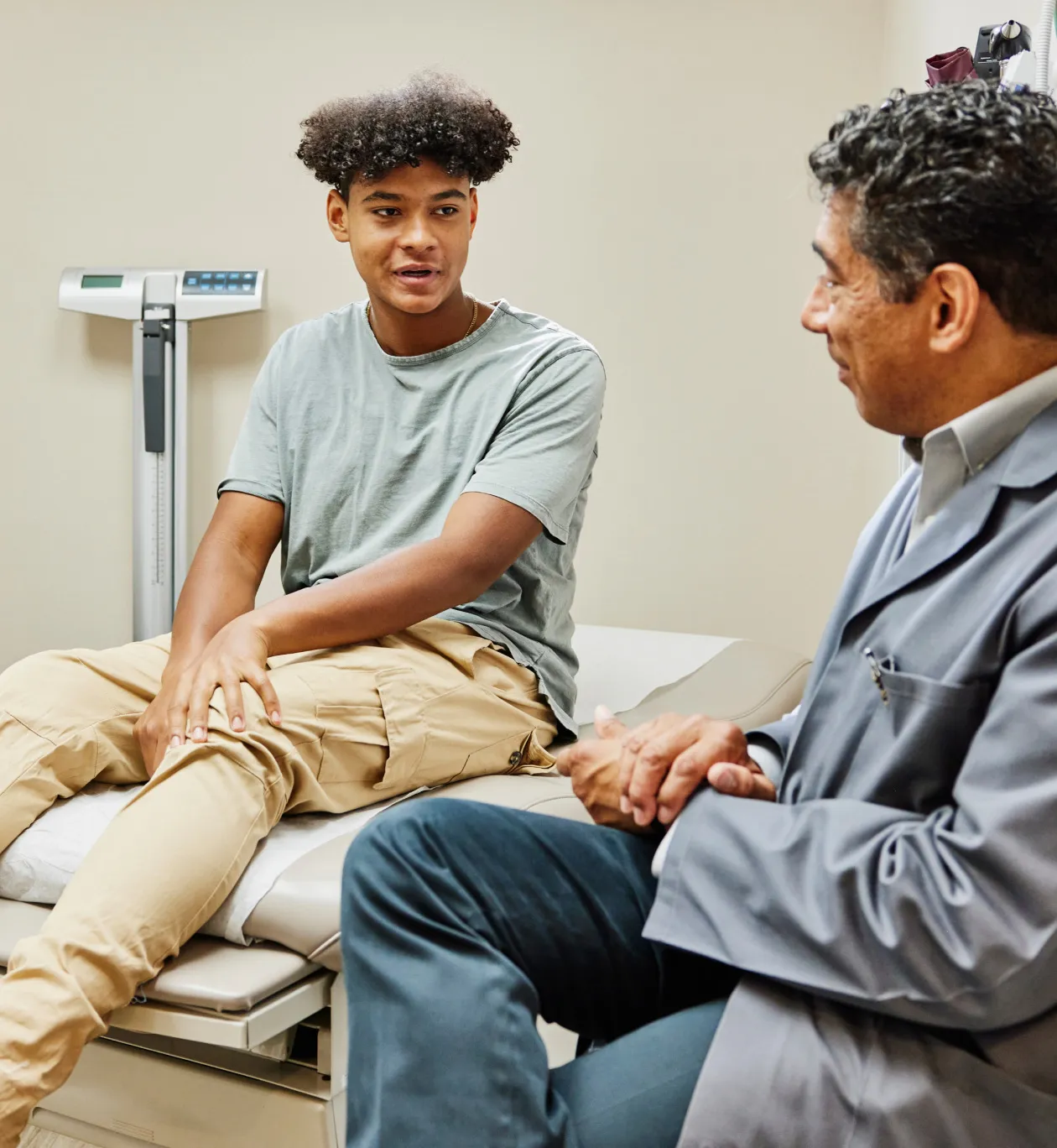 Pediatric Crohn's patient and family meeting with their care team