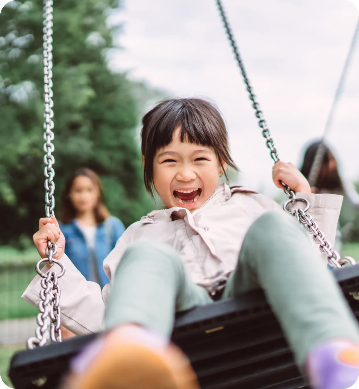 Pediatric ulcerative colitis patient playing on a swing