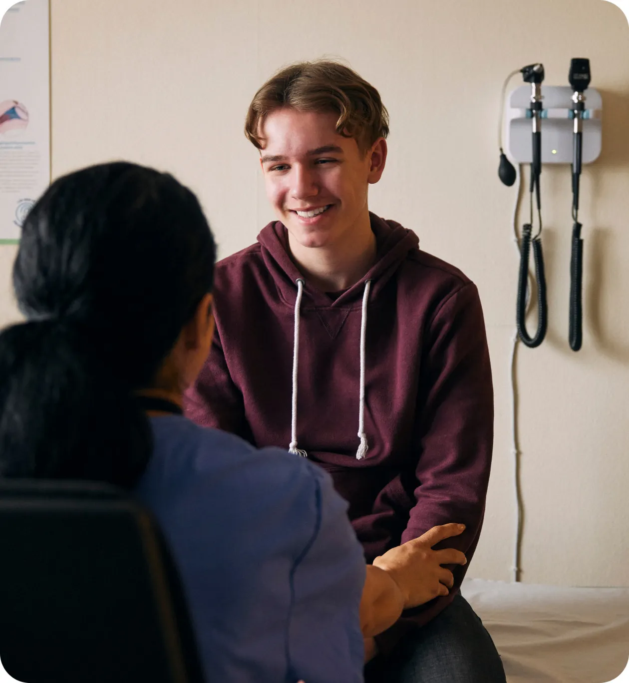 Teen ulcerative colitis patient talking with a provider